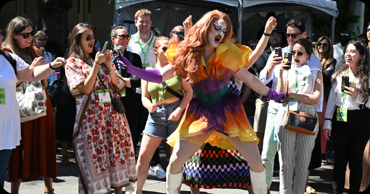 Drag queen environmentalist Pattie Gonia dances their way through a speed-networking event at the Climate Creatives Stage.